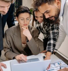 Small business team reviewing a website project on a laptop