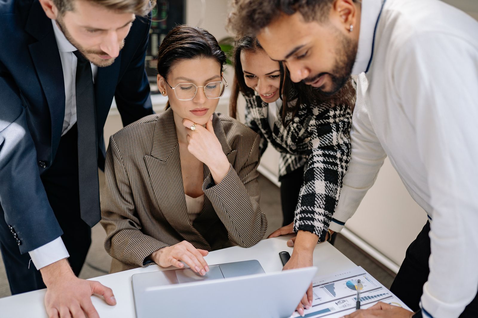 Small business team reviewing a website project on a laptop
